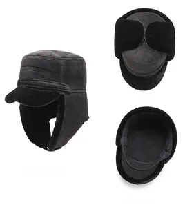 Close-up of black suede winter hat with plush faux fur lining and ear flaps for warmth