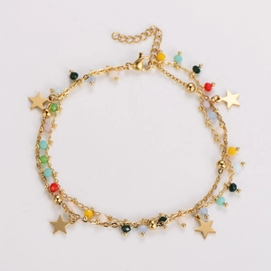 Detail view of gold double-layer star bracelet with colorful beads and lobster clasp