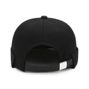 Minimalist black docker hat featuring adjustable leather strap and silver metal buckle
