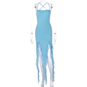 Detail of light blue slim fit dress featuring cross neck straps and ruffled tulle hem