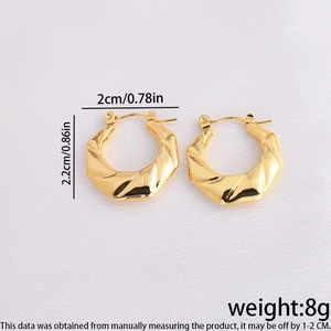 Detailed dimensions of gold flower earrings showing 2.2cm height and 8g weight on silk
