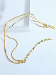 Close-up of dual-layer gold snake chain bracelet with adjustable lobster clasp