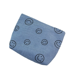 Blue corduroy makeup bag with smiling face pattern and portable travel design