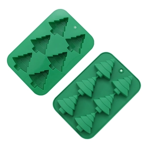 Detail of 4 and 6-cavity green silicone molds for Christmas tree shaped candies