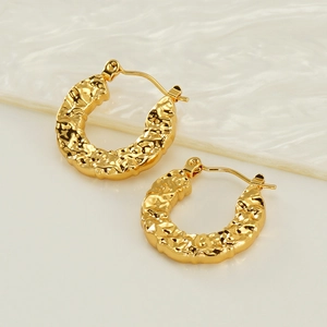 U-shaped gold stainless steel earrings with hammer texture shown from a side view