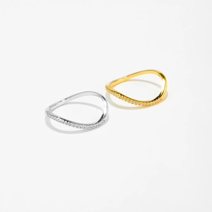 Detailed close-up of wavy S925 sterling silver rings with micro-paved diamonds