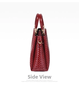 Detail of red woven texture on a large capacity tote bag with gold metal D-ring buckle