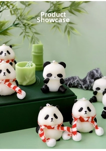 Close-up of panda shaped candles with knitted scarves and bamboo style decor props