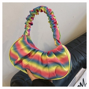 Detail of colorful rainbow pleated shoulder bag with soft textured gradient finish