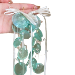 Mint green round disc drop earrings with white satin ribbon bow for a romantic look