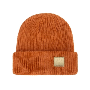 Detailed knit texture of orange winter beanie with cute smiley face patch and ribbed cuff