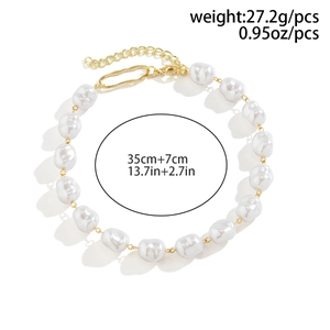 Close-up of pearl necklace with gold clasp measuring 35cm plus 7cm extension chain
