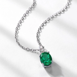 Oval emerald green gemstone pendant with silver necklace for women in vintage style