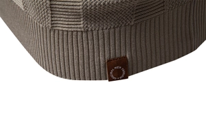 Close-up of knit polo shirt showing waffle texture and ribbed hem detail for men