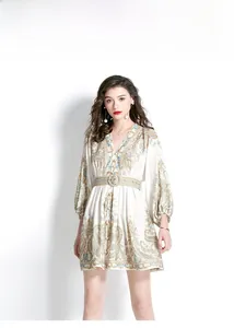 Close-up of V-neckline and lantern sleeves on a boho paisley print mini dress