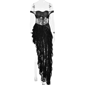 Detail of sheer black lace dress with asymmetrical ruffle hem on clear mannequin