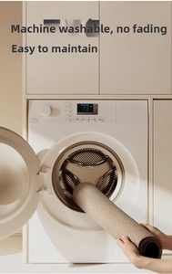 Machine washable beige kitchen mat showing easy maintenance and foldable woven texture