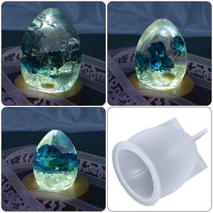 Macro view of clear resin egg art with blue rose inside and its silicone mold