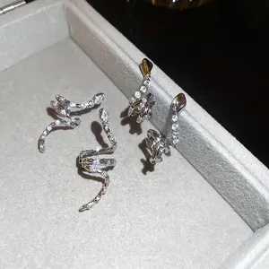 Zirconia snake stud earrings and ear cuffs in silver finish with pavé set crystals