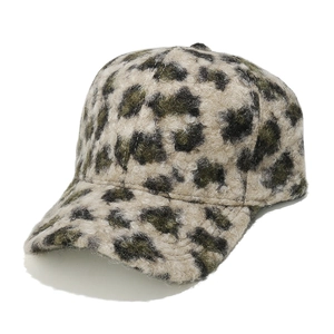 Detail view of the leopard print faux shearling texture on a winter baseball cap