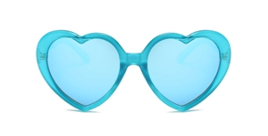 Macro shot of stylish heart-shaped sunglasses featuring blue lenses and transparent frames