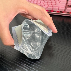 Detail of printed stand-up pouch with aluminum foil lining and secure zipper closure
