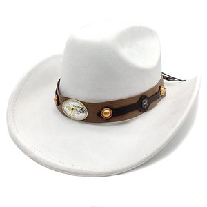 Detail of white western cowboy hat featuring a silver bull head buckle and brown leather band