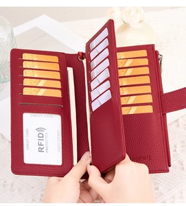 Detail of red RFID blocking wallet with multiple card slots and lychee texture