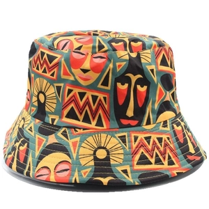 Reversible bucket hat with tribal lion patterns and colorful geometric prints