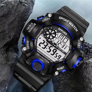 Waterproof tactical sport watch with digital display on a rugged rock outdoor setting