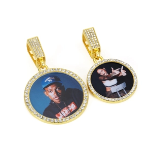 Detail of round custom photo pendants with sparkling crystal inlay on gold metal finish