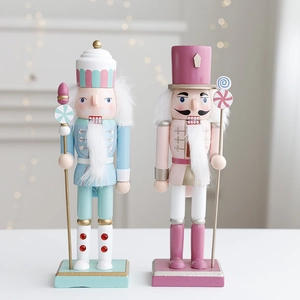 Set of mint blue and pink wooden Nutcracker soldiers with candy theme and glitter details