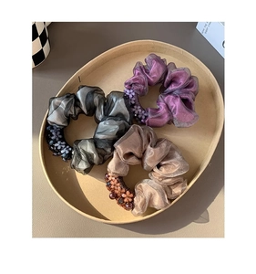 Trio of tulle hair scrunchies in purple, grey and beige with floral bead accents