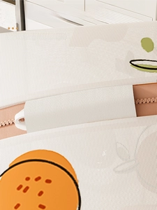 Detail view of the secure zipper lock and protective cover on a mesh laundry bag