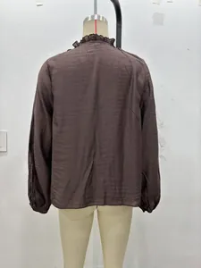 Detailed back view of a dark brown chiffon blouse with layered ruffles and cuffed sleeves