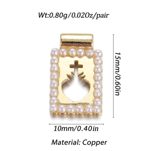 Detailed view of gold plated sacred heart cross pendant with small pearl border and dimensions