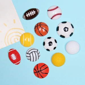 Flat lay of colorful resin sports ball charms including football and basketball