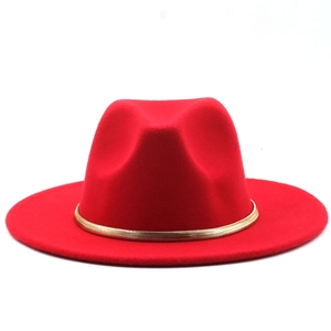 Detailed view of elegant red wool fedora hat with decorative gold metal band detail
