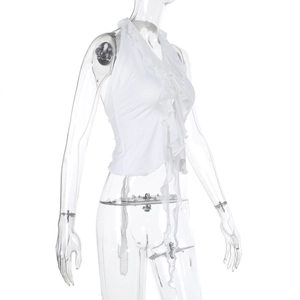 Detail view of white ruffle halter top with side tie design for summer beach wear