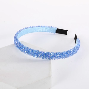 Detailed view of handmade light blue beaded headband with sparkling crystal beads and fabric tips