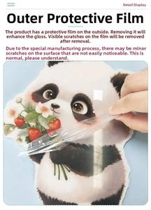 Detail showing removal of protective film from a glossy panda wall sticker
