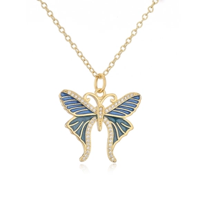 Macro detail of butterfly pendant with blue enamel and sparkling cubic zirconia stones