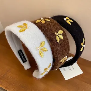Retro plush headbands with pearls and gold leaves in white, brown, and black colors