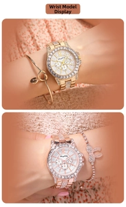 Close-up of luxury women's watch set with crystal bezel and matching gold bracelets