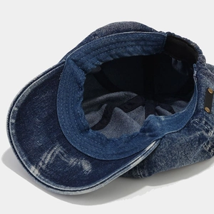 Vintage washed denim newsboy cap in dark blue with adjustable elastic and metal rivets