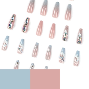 Blue and pink gradient press-on nails with snowflake glitter and rhinestone accents