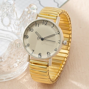 Vintage gold quartz watch with elastic band and heart-shaped needles on cream dial
