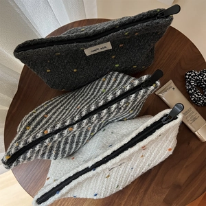 Three-piece set of woven knit cosmetic bags with colorful polka dots in assorted colors