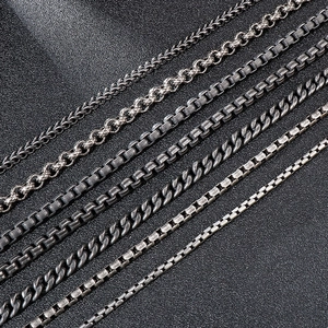 Various vintage stainless steel keel chains and cuban links in a dark silver finish