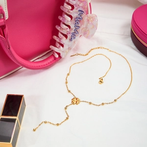 Collier élégant en trèfle doré en forme de Y avec pompon long et strass brillants